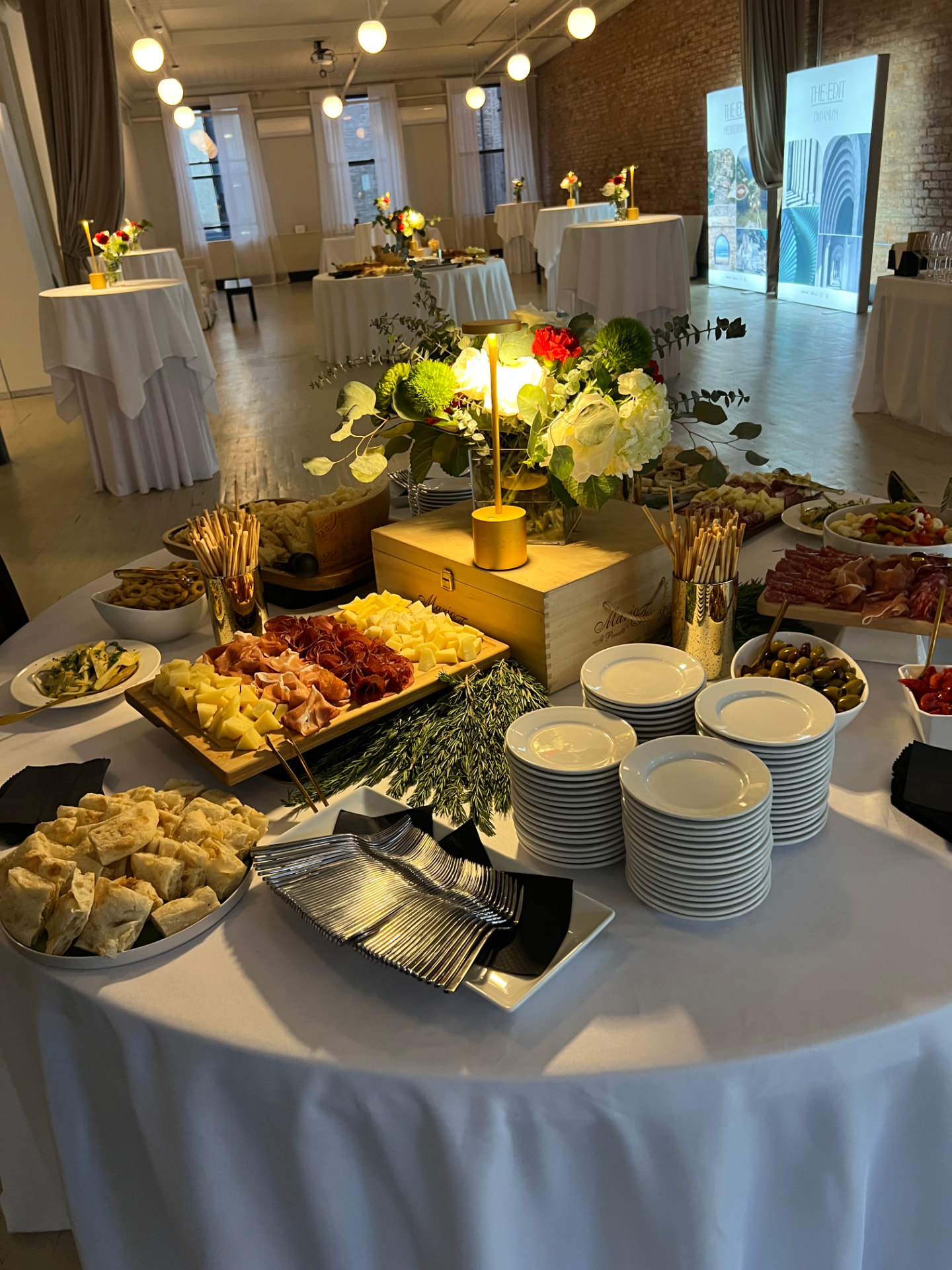 Italian buffet display with desserts, antipasti, and styled table settings